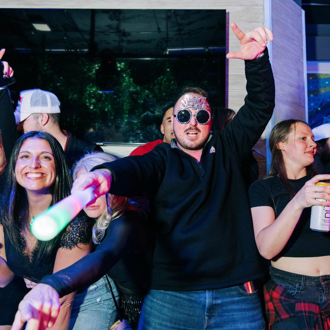 Guy dancing to DJ entertainment at Ballpark Village NYE party