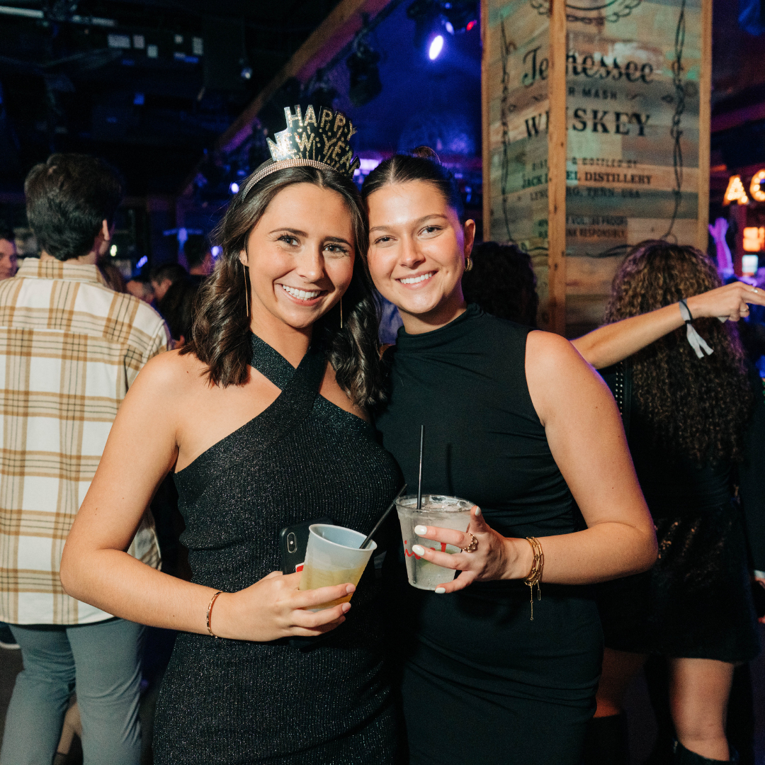 Two friends celebrating NYE Live! at Ballpark Village